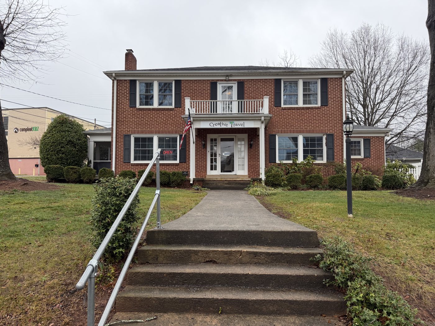 Two-story brick house at 34 Myrtle Street in Belmont; Ellison Psychological Services is on the upper floor